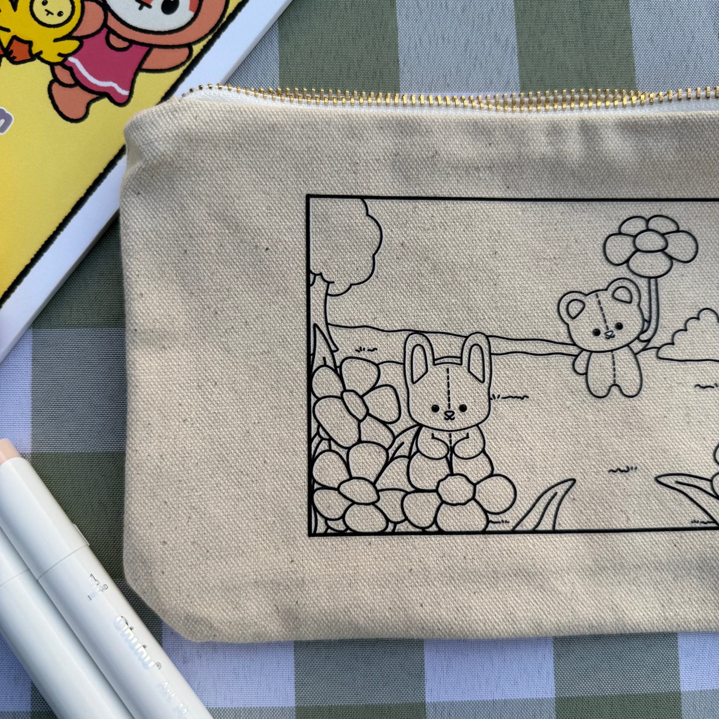 Pouch with a cartoon design of a bear and a fox on a checkered background